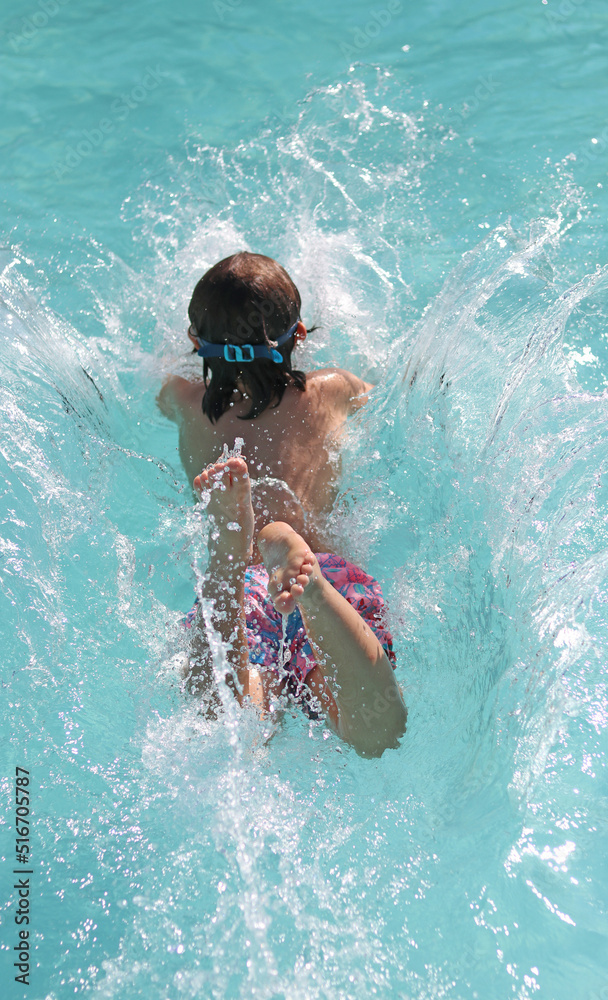 Boy enjoying in a swimming pool