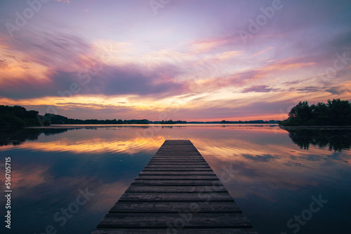 Fototapeta Naklejka Na Ścianę i Meble -  Colorful sunset over beautiful calm lake. High quality photo