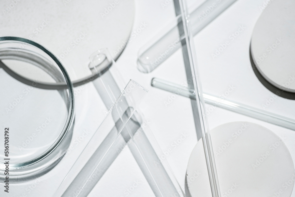 Test tubes, petri dish and glass rods in the laboratory on white