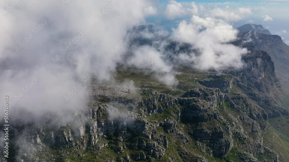 Cloudscape rolling above majestic mountain range in South Africa, aerial view Cloudscape rolling above majestic mountain range in South Africa, aerial view