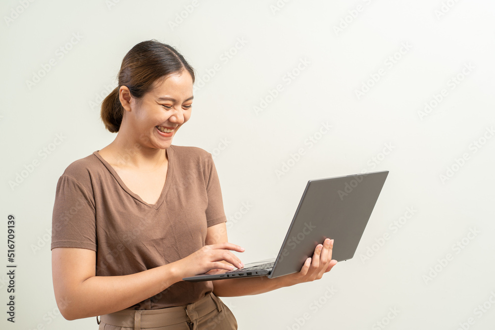 Asian women holding laptop computer. Work from home business concept. Asian women holding laptop computer. Work from home business concept.