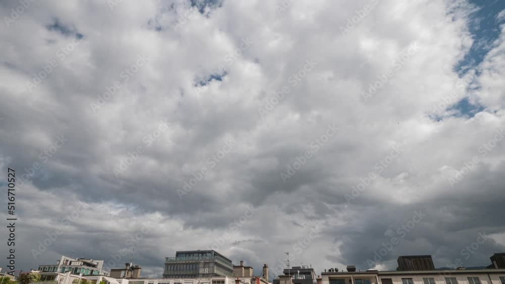 Time lapse of fast moving storm clouds over some urban buildings rooftops. Time lapse of fast moving storm clouds over some urban buildings rooftops.