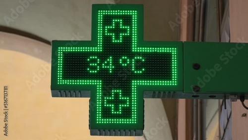 Danger high temperature alert. Hot alert. The green cross shows a high temperature on the thermometer and a health hazard warning.