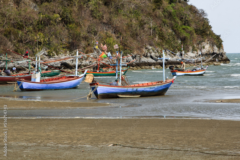 small fishing boat that catches fish and squid along the coast in a traditional way and maintains an ecosystem of fish and marine life for a long time on strong and windy days.