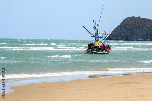 small fishing boat that catches fish and squid along the coast in a traditional way and maintains a fish and marine ecosystem for a long time on windy days-Prachuap Khiri Khan - 5 - 6 - 2016