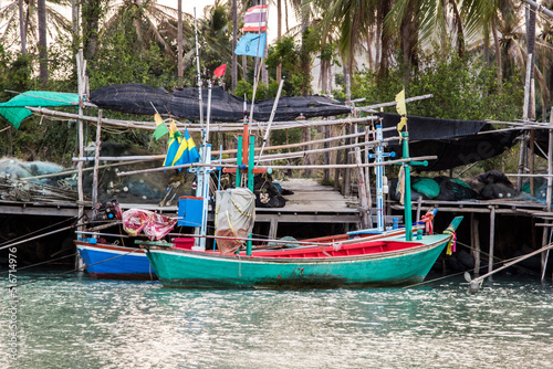 small fishing boat that catches fish and squid along the coast in a traditional way and maintains an ecosystem of fish and marine life for a long time on strong and windy days.