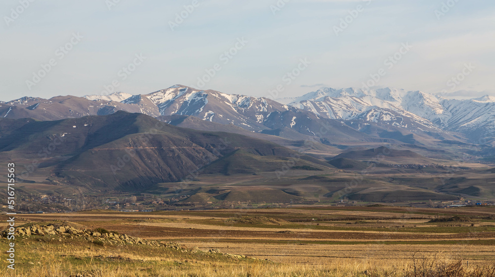 A stunning mountain landscape. Snow-covered mountains and yellow valleys. Zangezur Mountains. Armenia