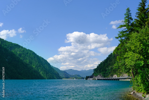 picturesque lake Achensee in Austria, green mountains rises above the calm expanse of water, the concept of the beauty of nature, vacation by the reservoir, water sports, resort place tyrol © kittyfly