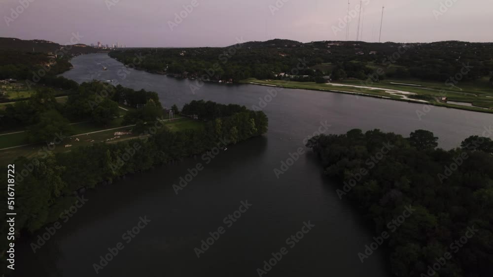 Austin Texas paddleboarder on lake Travis during sunset - Pennybacker Bridge Austin Texas paddleboarder on lake Travis during sunset - Pennybacker Bridge