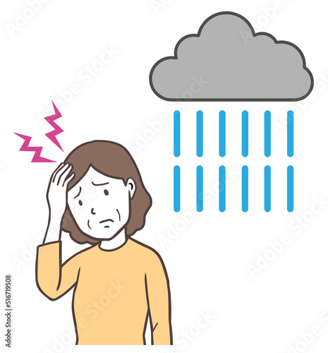 雨の日に頭痛になる中年女性、低気圧頭痛、天気痛