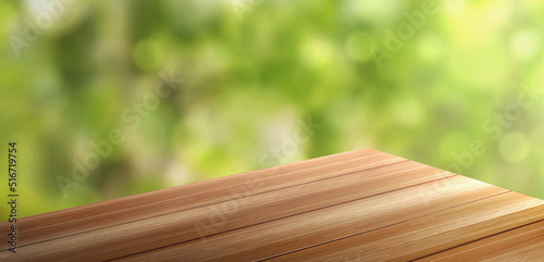 Wooden table corner perspective view on green blurred background. Wooden surface of desk, brown outdoor tabletop angle for products display, presentation, advertising, Realistic 3d vector illustration