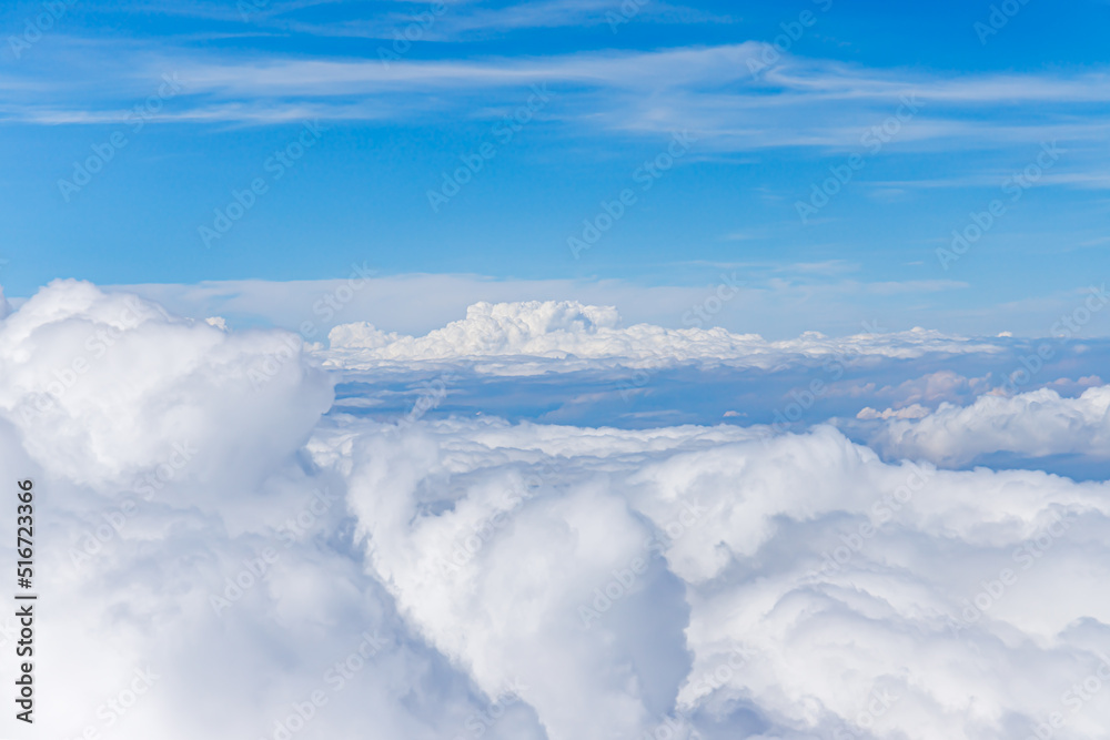 Clouds from above. View from airplane. blue sky view from plane. sky wallpaper with space for your text . Aerial view of the blue sky. High in the Heavens. View from Airplane Window Clouds from above. View from airplane. blue sky view from plane. sky wallpaper with space for your text . Aerial view of the blue sky. High in the Heavens. View from Airplane Window