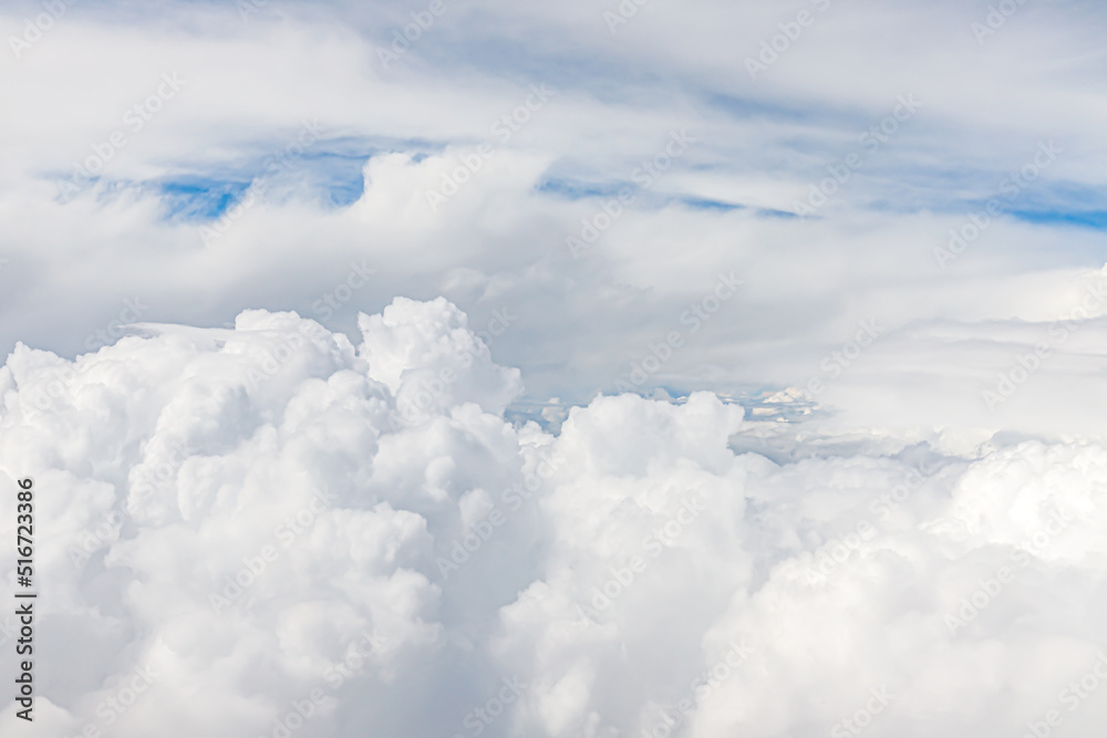 Clouds from above. View from airplane. blue sky view from plane. sky wallpaper with space for your text . Aerial view of the blue sky. High in the Heavens. View from Airplane Window Clouds from above. View from airplane. blue sky view from plane. sky wallpaper with space for your text . Aerial view of the blue sky. High in the Heavens. View from Airplane Window