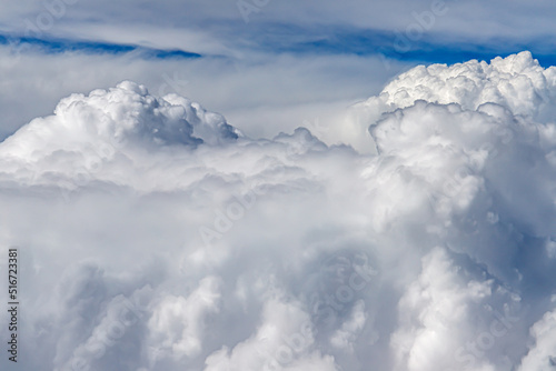 Clouds from above. View from airplane. blue sky view from plane. sky wallpaper with space for your text . Aerial view of the blue sky. High in the Heavens. View from Airplane Window