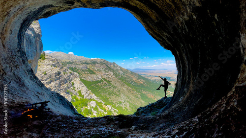 exuberant happiness of discovering extraordinary places and mystical cave views © emerald_media