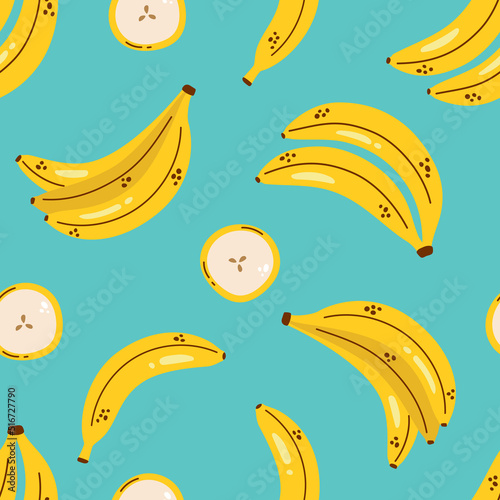 Cute pattern with yellow bananas on blue background. Banana seamless pattern. Tropical fruit.