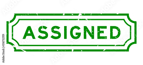 Grunge green assigned word rubber seal stamp on white background