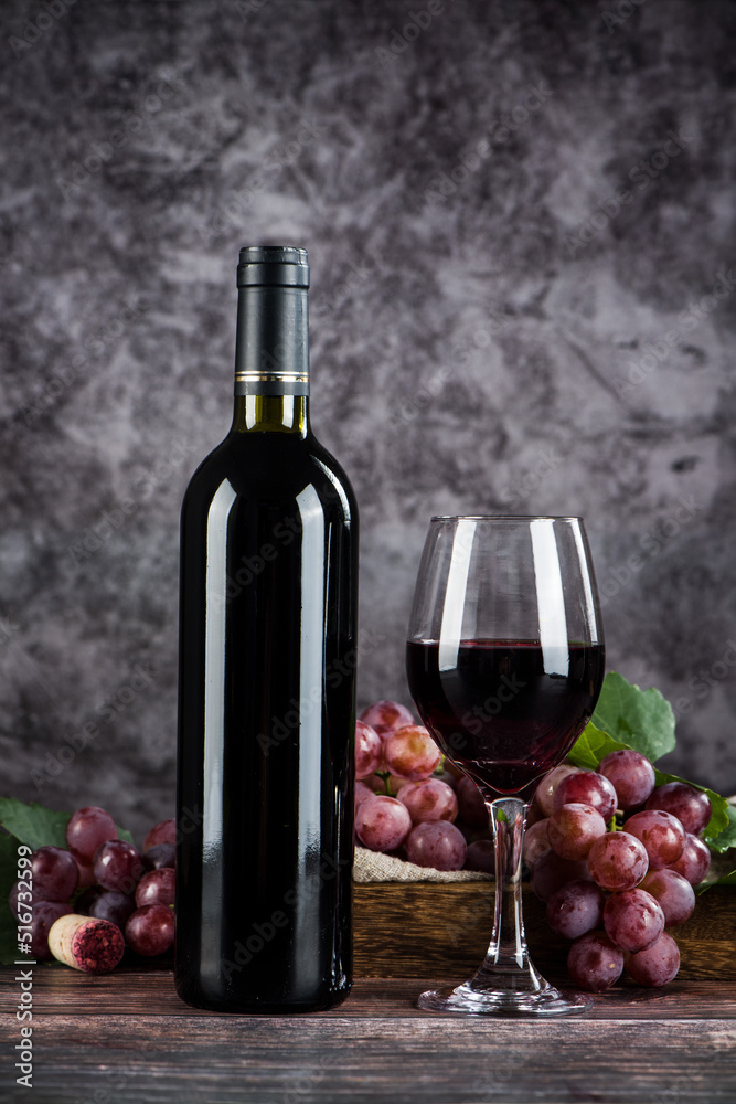 wine glass with red wine on wooden table