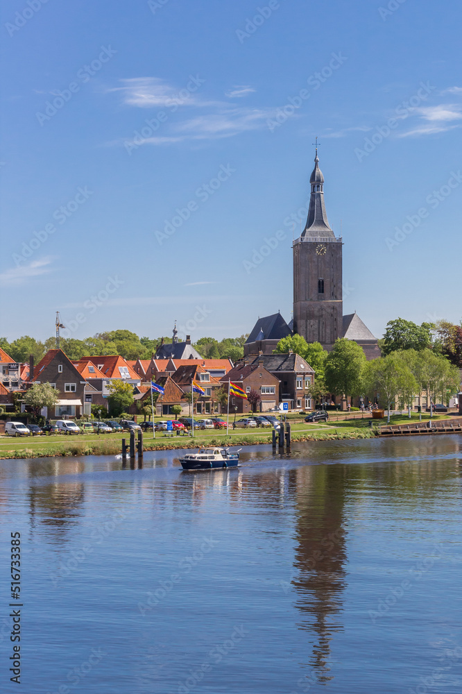 River and tower of the Stephanus church in Hasselt, Netherlands