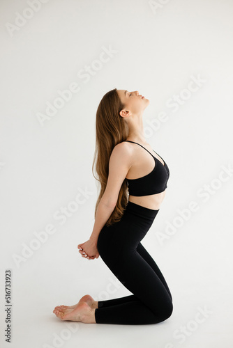 Beautiful girl doing an exercise for correct posture