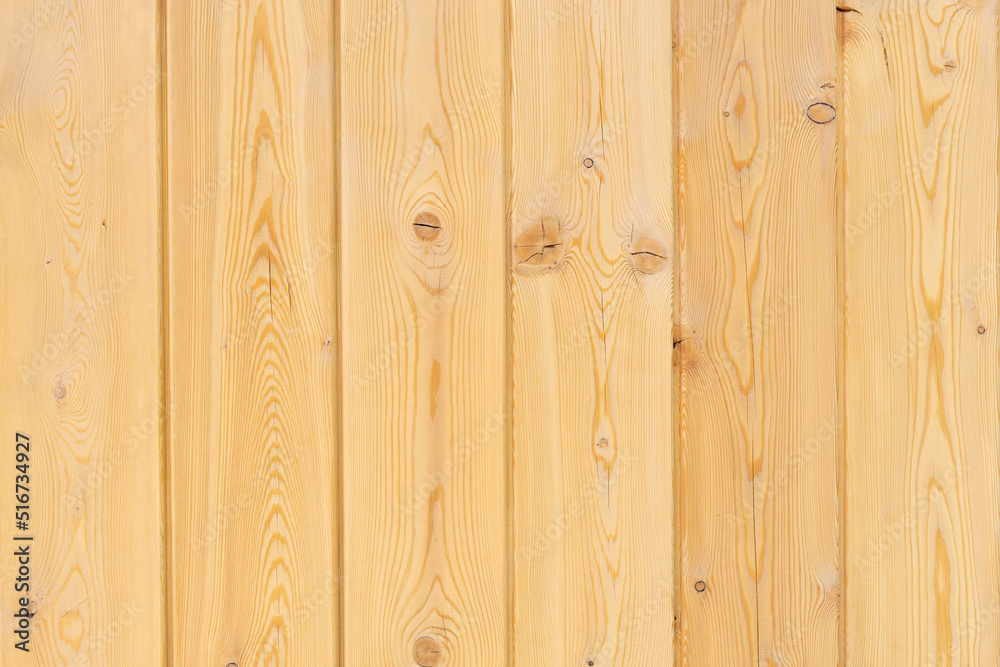 Texture of unpainted light wooden boards with a pattern from knots. Background.