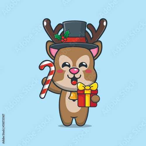 Cute deer holding christmas candy and gift. Cute christmas cartoon illustration.