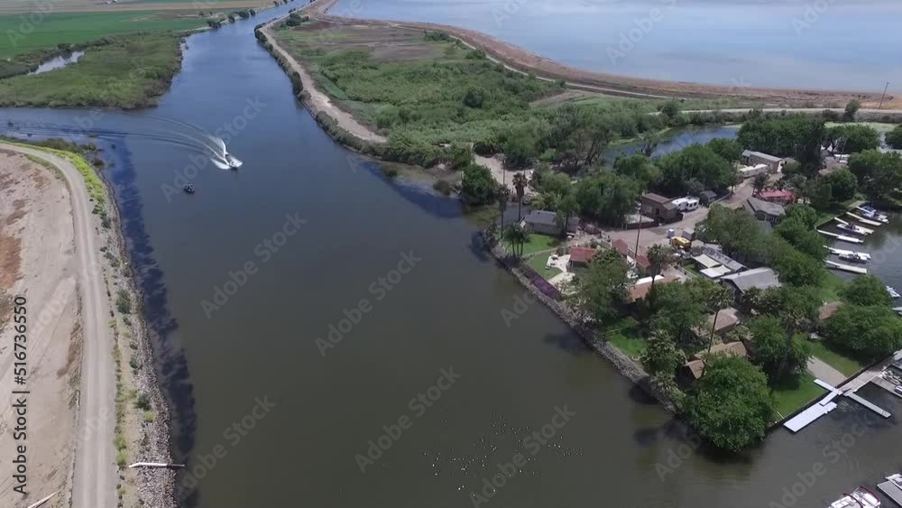 Aerial Drone video of Riverside Neighborhood with boats and canals Aerial Drone video of Riverside Neighborhood with boats and canals