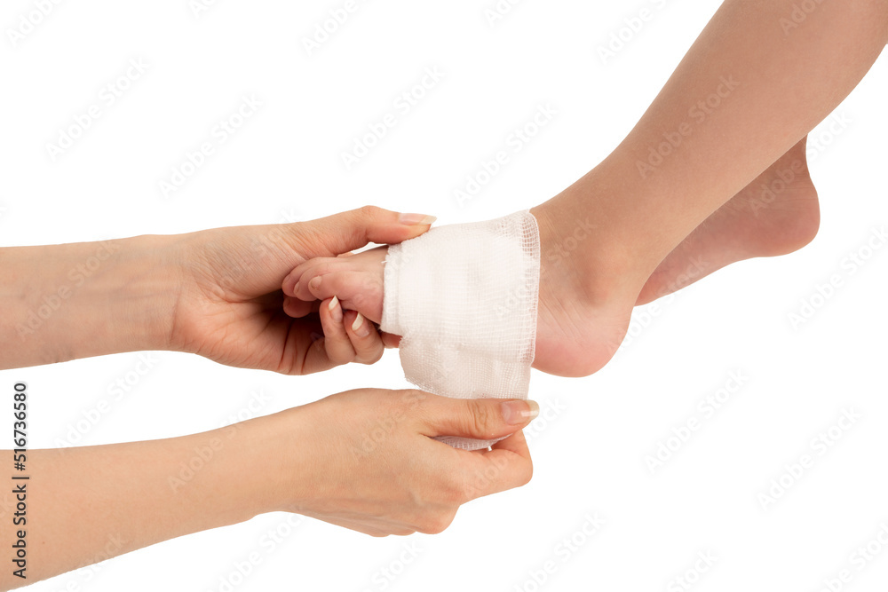 Caring mother wounded bandage around little's boy injured leg after accident. Caring mother wounded bandage around little's boy injured leg after accident.