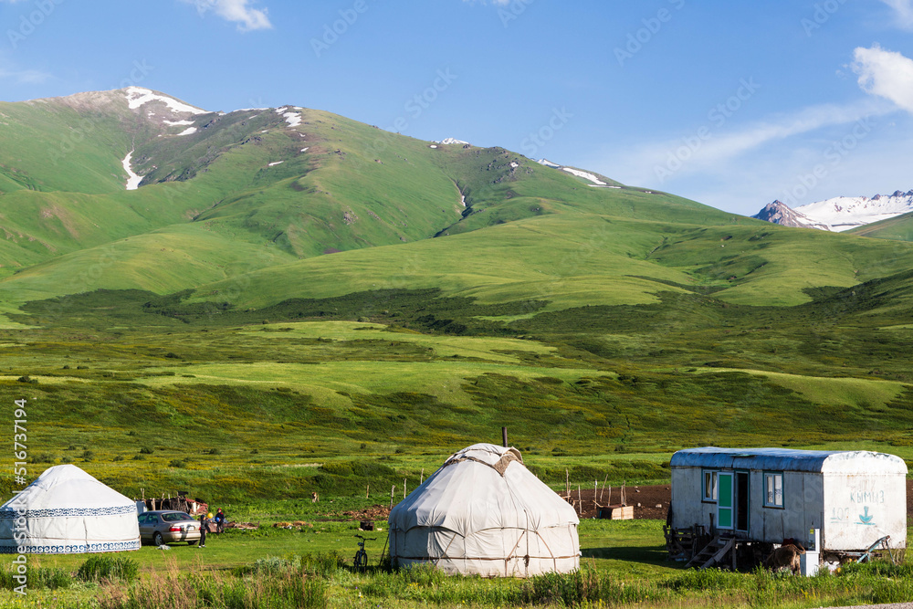Ala Bel pass, Kyrgyzstan - June 2022: Kyrgyz Yurts and other summer dwellings in the mountains.Ala Bel pass, Bishkek Osh highway in Kyrgyzstan