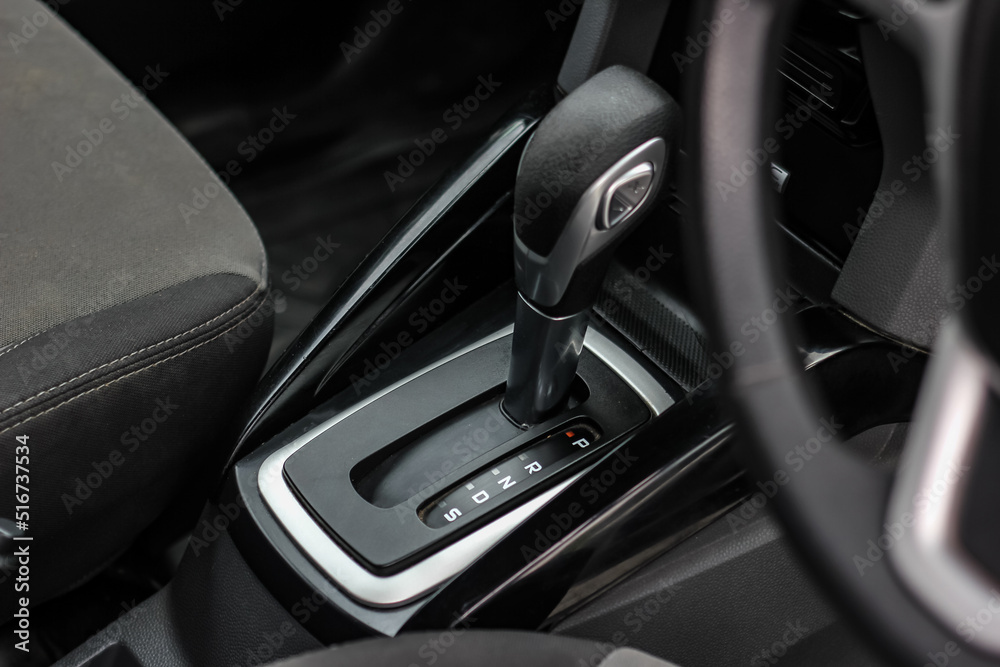 automatic transmission shift selector in the car interior. Closeup a manual shift of modern car gear shifter. 4x4 gear shift