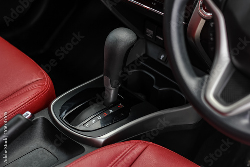 automatic transmission shift selector in the car interior. Closeup a manual shift of modern car gear shifter. 4x4 gear shift © Muanpare