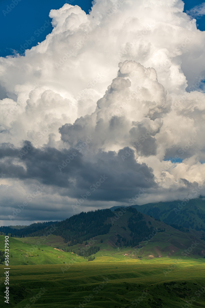 heavy clouds shadow on green plain and mountains heavy clouds shadow on green plain and mountains