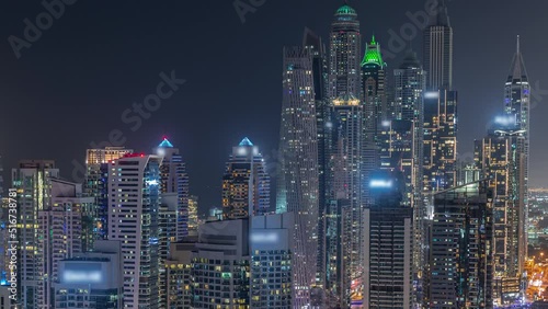 Wallpaper Mural View of various skyscrapers in tallest recidential block in Dubai Marina aerial night timelapse with artificial canal. Many towers with glowing windows and yachts Torontodigital.ca