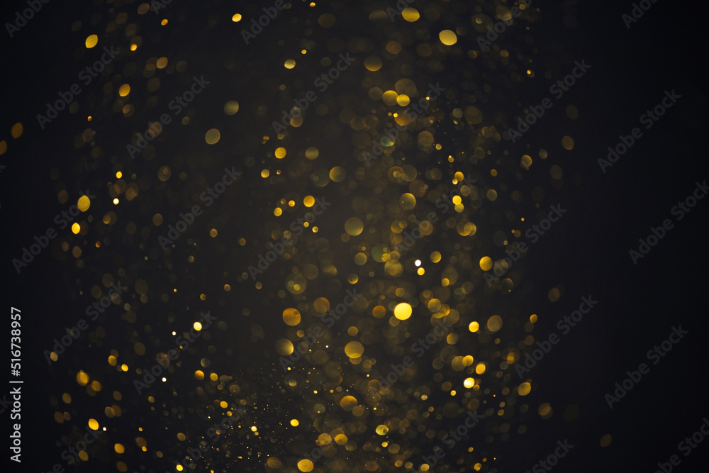 Gold glitter particles lights abstract bokeh background