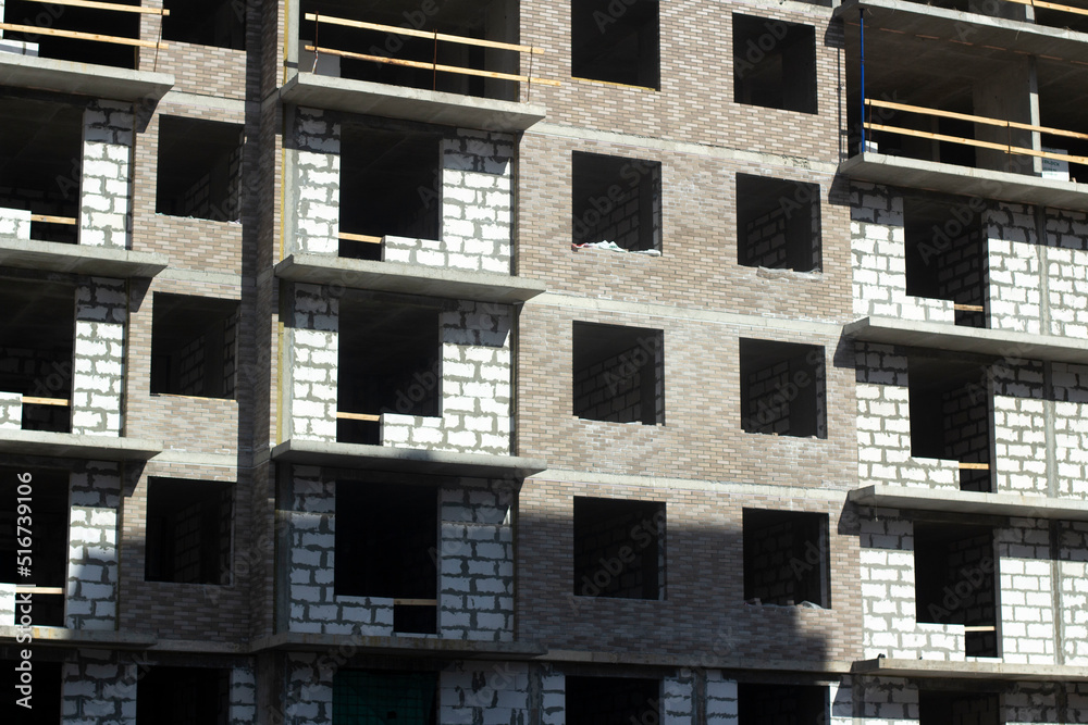 Building in city. Architecture details. Lots of windows in house. Building in city. Architecture details. Lots of windows in house.