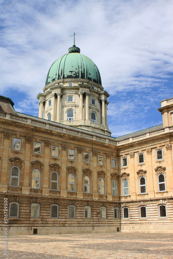 Exterior view of Buda Castle, the historical Royal Palace in Budapest, Hungary, Europe. Facade and dome of the Hungarian baroque castle.