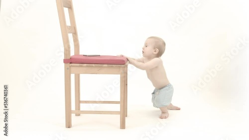 little child sitting on a chair