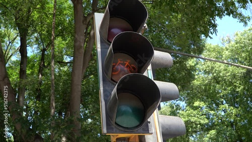 Close up of a traffic light at a crossroads for bicycles. Red, yellow, green lights for bicycles.