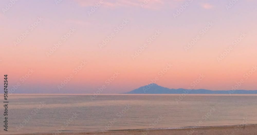 Amazing summer sunset light over the Aegean seascape horizon. Beautiful view on Mount Athos, peninsula in northeastern Greece. 4K footage. Amazing summer sunset light over the Aegean seascape horizon. Beautiful view on Mount Athos, peninsula in northeastern Greece. 4K footage.