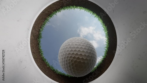 Golf ball rolling into hole, closeup view inside hole looking up, 3D animation in UHD 4K