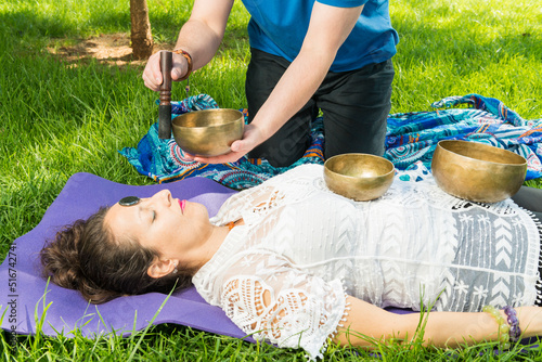 Woman during a singing bowl session.