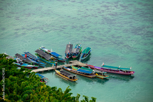 A passenger boat on the pier as seen from the top of the mountains