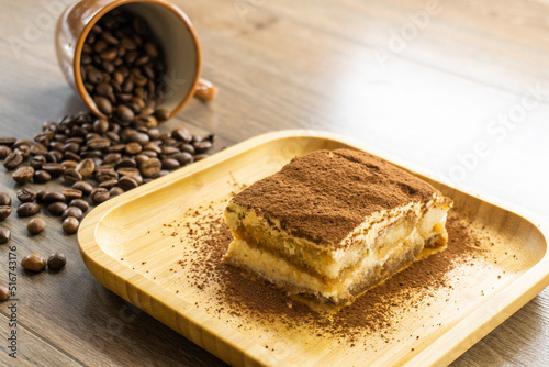 teramisu in a wooden bowl. food concept.coffee beans