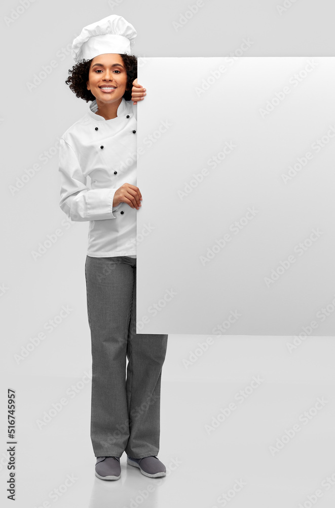 cooking, advertisement and people concept - happy smiling female chef in toque with white board over grey background cooking, advertisement and people concept - happy smiling female chef in toque with white board over grey background