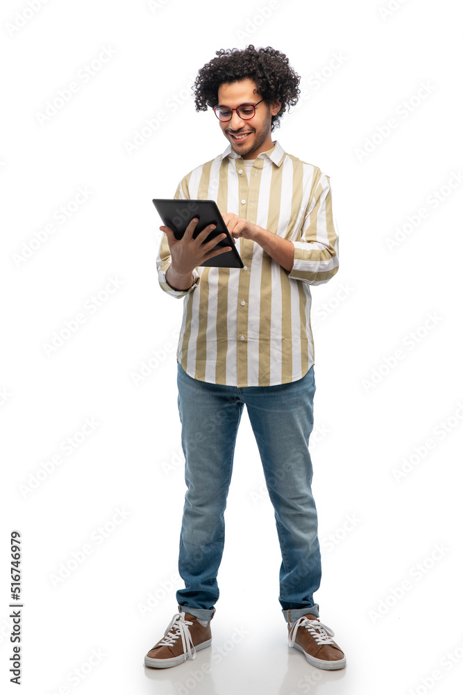technology and people concept - happy young man in glasses with tablet pc computer over white background technology and people concept - happy young man in glasses with tablet pc computer over white background