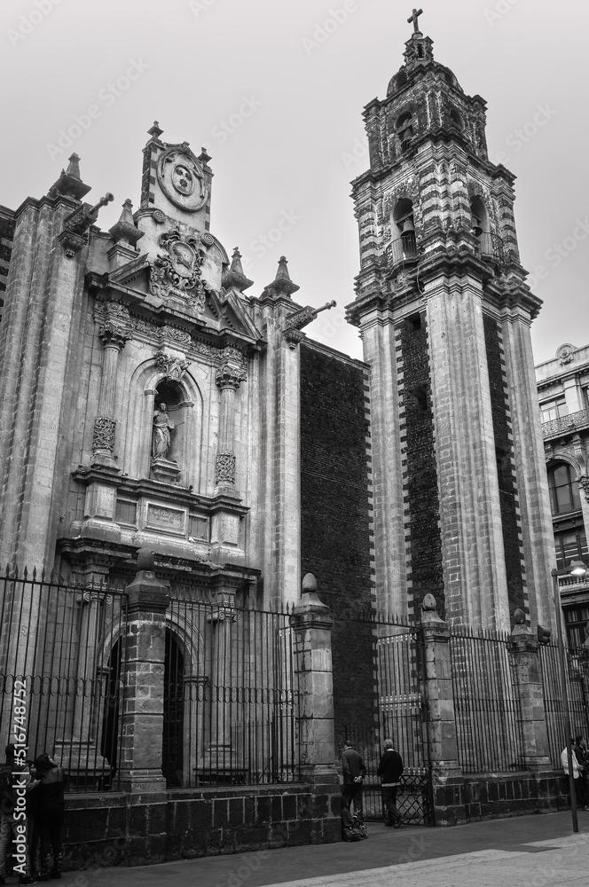 Interesting historic buildings in black and white on 5th Avenue in the historic centre near Zocalo Square -pedestrain streets in Mexico City, Mexico.