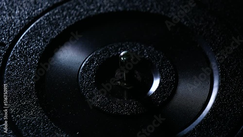 Putting a vinyl record onto a record player. photo