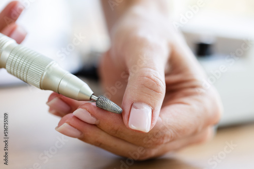 Removing shellac from the nails with fraser. Closeup. Selective focus. photo