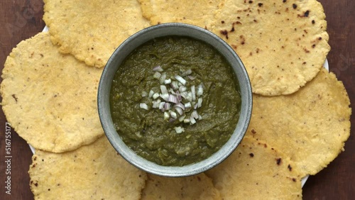 Punjabi Sarson ka saag and makki ki roti meal. Authentic north Indian dish. Top view, table spin. photo