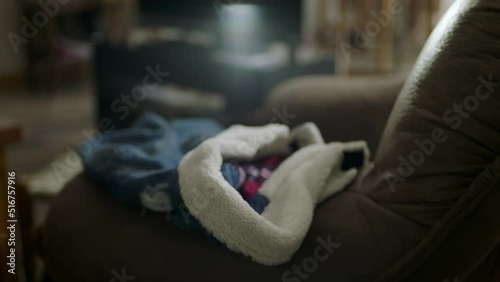 A man is taking the jacket. Warm jacket on a coach